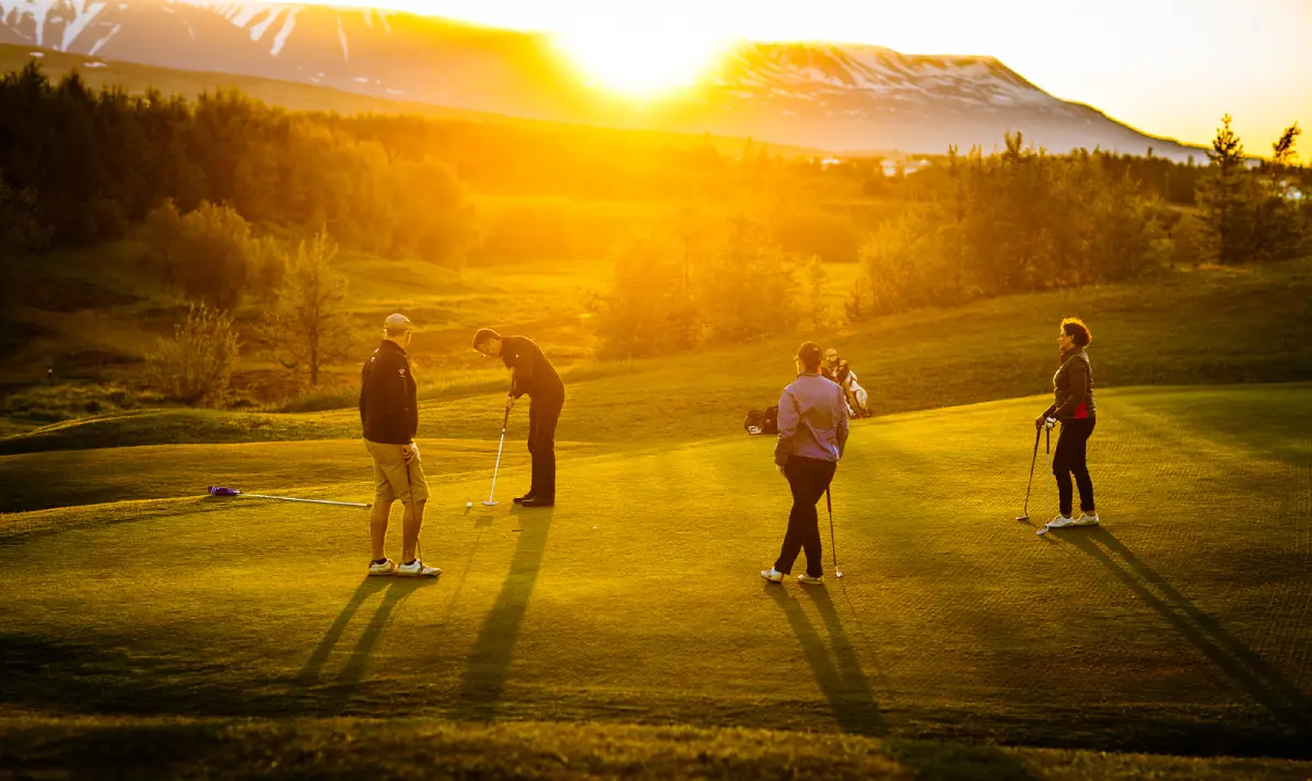 Golfers putting under the midnight sun at Ja&eth;arsv&ouml;llur, Akureyri