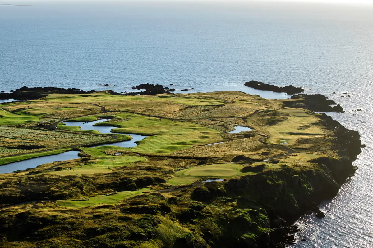 Aerial view of Brautarholt Golf Club on a coastal peninsula