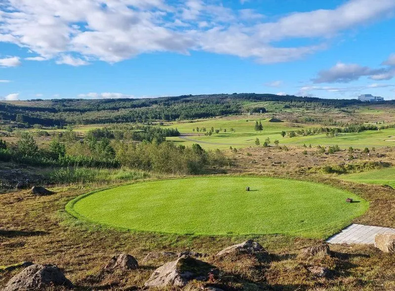 Elevated putting green overlooking the valley at Grafarholt Golf Course