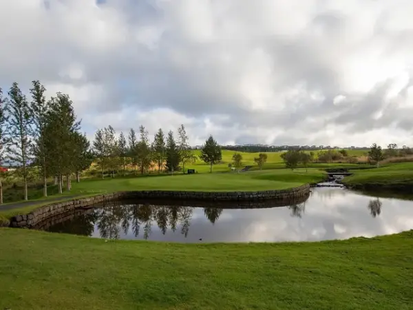 Pond and green at Grafarholt Golf Club in Reykjav&iacute;k