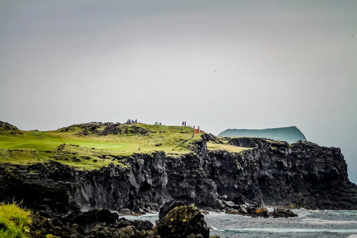 Green perched on the cliff edge above the ocean at Vestmannaeyjar Golf Course